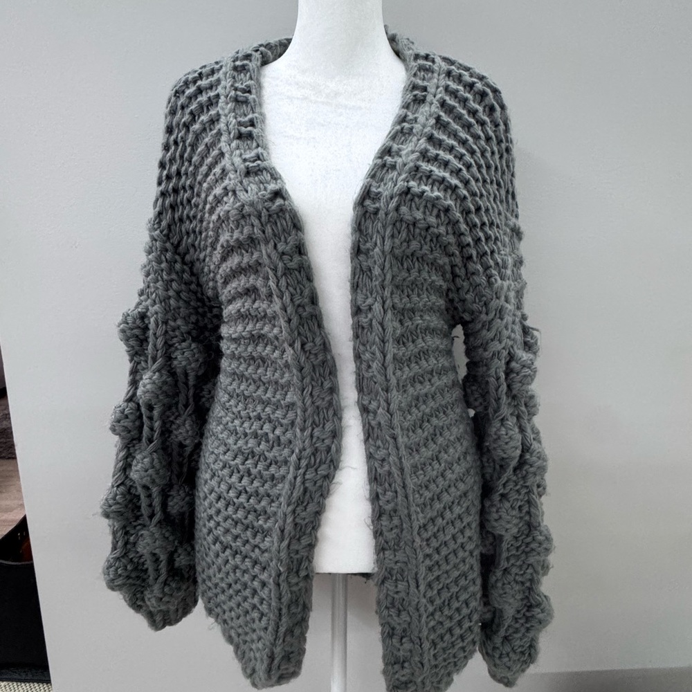 Gray knitted sweater.Size M